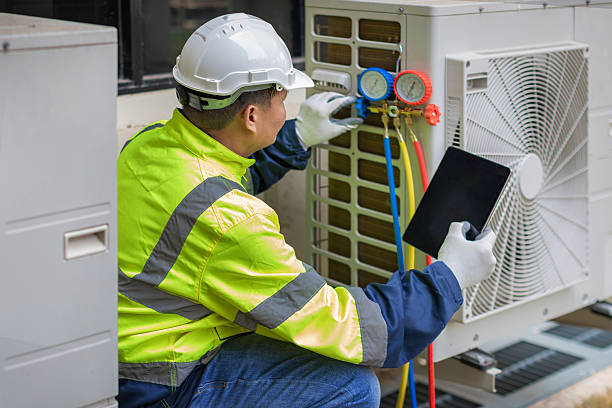Professional Air Conditioning Repair technician working in Fort George G Meade, MD
